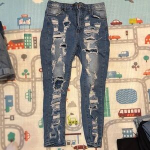 Blue High Waisted Skinny Jeans with Distressed Detailing